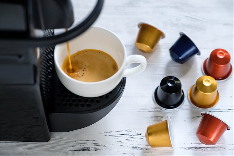 Espresso preparation. Capsule coffee machine. 